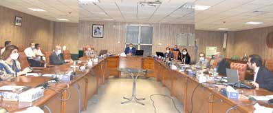Advisor chairing meeting on PRMI at BOI